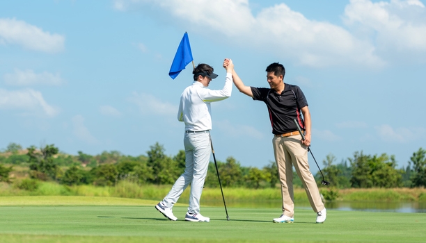 Group Professional Golfer asian man shake hand for friendship after finish put ball on green. Hobby relax in holiday and vacation with friends. Lifestyle and Sport Concept