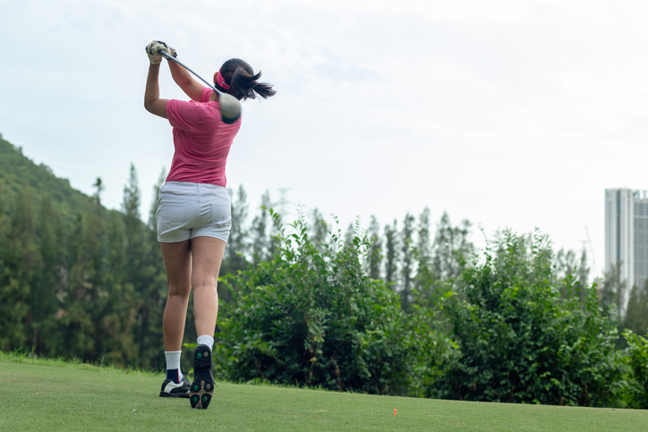 Golfer women sport course golf ball fairway. People lifestyle woman playing game golf tee of on the green grass. Asia female player game shot in summer.